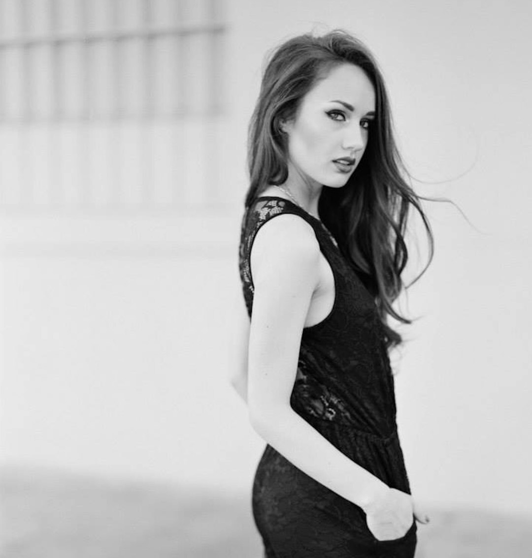 Studio portrait of a glamorous woman in elegant dress
