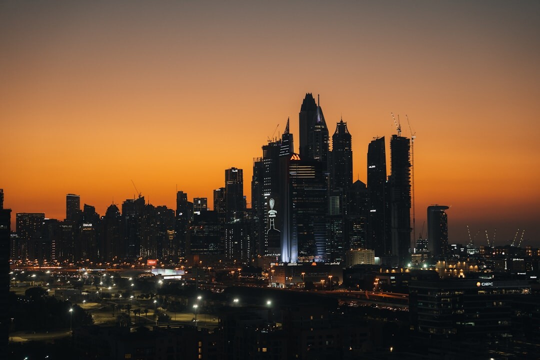 City skyline at dusk with warm lights