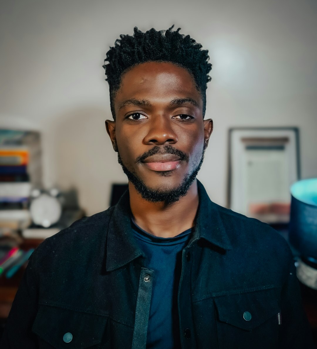 Studio portrait of a smiling man in casual shirt