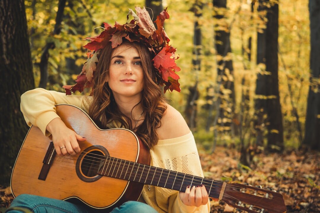 woman holding guitar