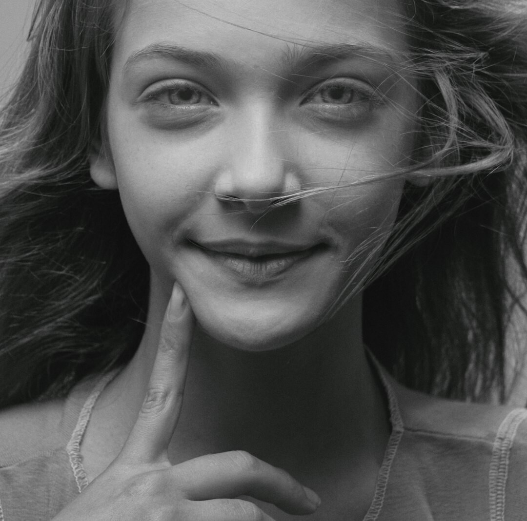 Studio portrait of a smiling young woman